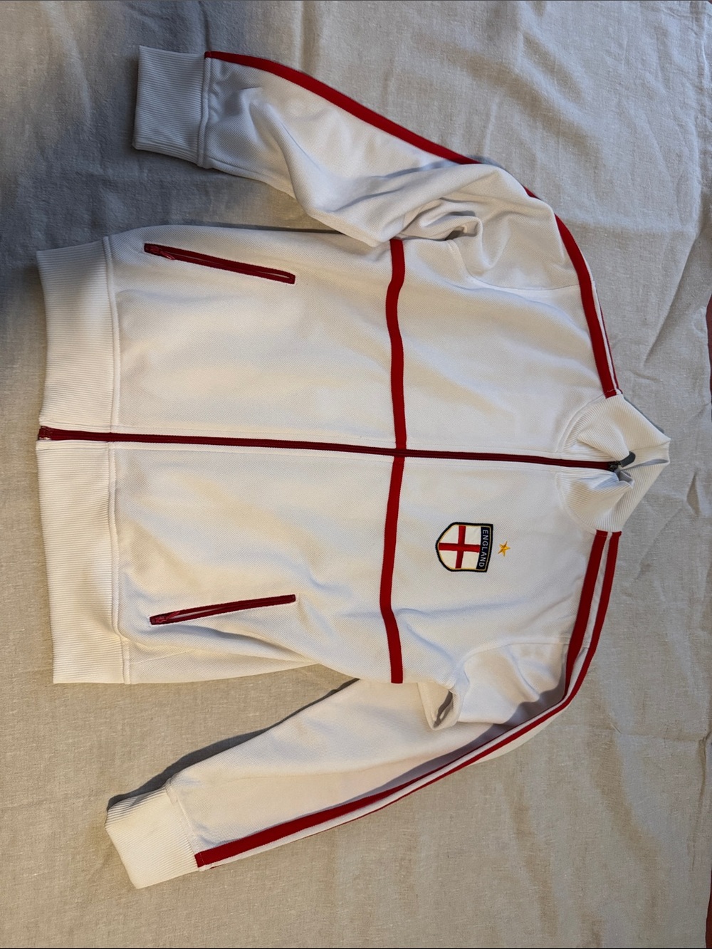 White Track Jacket with Red Trim and Crest